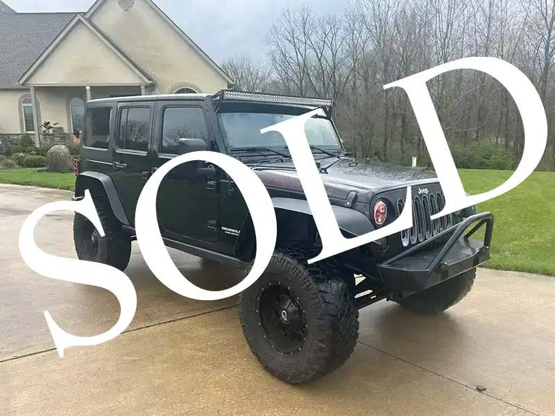 2013 Rubicon 6cyl 6 speed man trans. Loaded with options including hard and soft tops. 103k